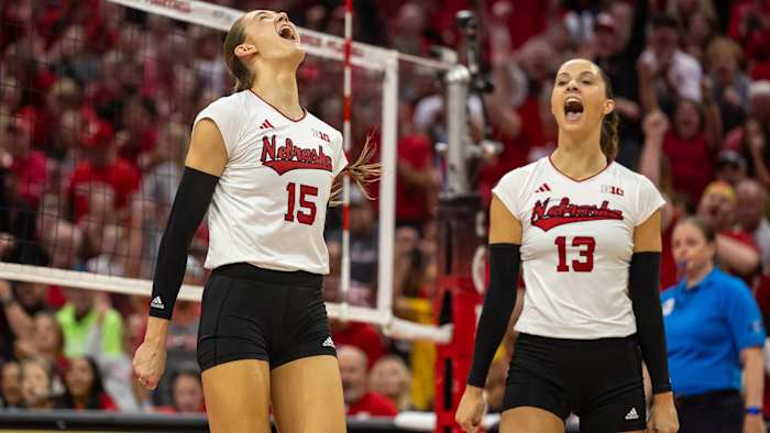 Nebraska middle blocker Andi Jackson (15) and outside hitter Merritt Beason (13) celebrate a point during the sweep of Penn State (Oct. 14, 2023)